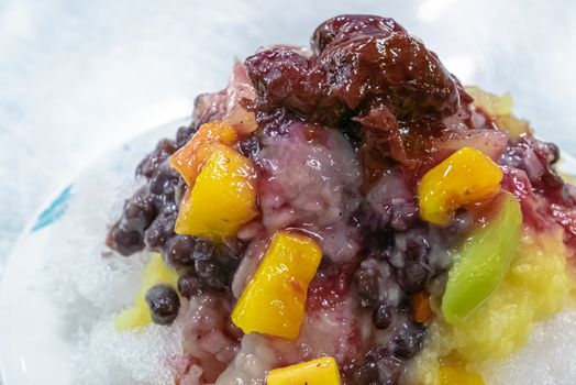 The close up of Taiwanese mixed fruit shaved Ice snowflake smoothie at night market in Kaohsiung, Taiwan.