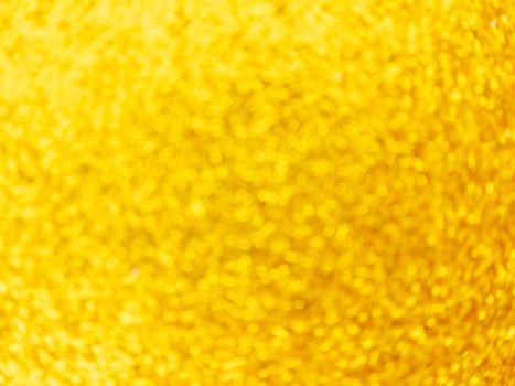Golden defocus lights background. Festive abstract swirling bokeh