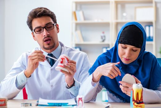 Dentist doctor and assistant working on new tooth implant