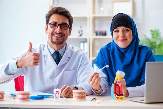 Dentist doctor and assistant working on new tooth implant