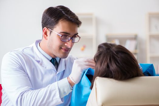 Patient visiting dentist for regular check-up and filling