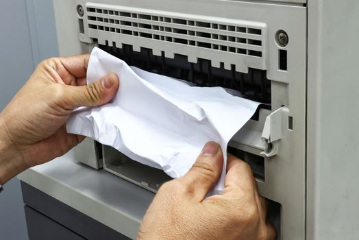 Technicians Removing Paper Stuck, Paper Jam In Printer At Office