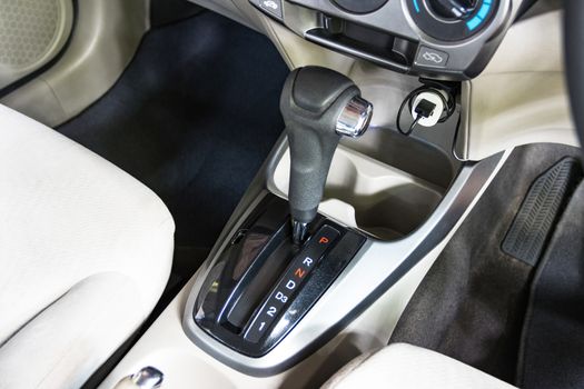 Close up the symbol of each auto gear for car shifting into P will try to engage the parking pawl to prevent the transmission