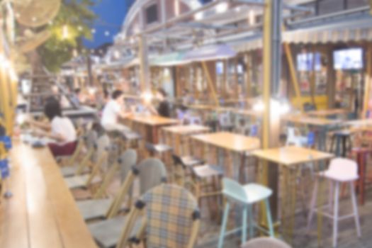 blurred image Lots of people enjoy at the bar pub fun of night festival in a restaurant and The atmosphere is party happy and relaxing.