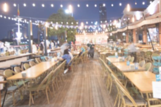 blurred image Lots of people enjoy at the bar pub fun of night festival in a restaurant and The atmosphere is party happy and relaxing.