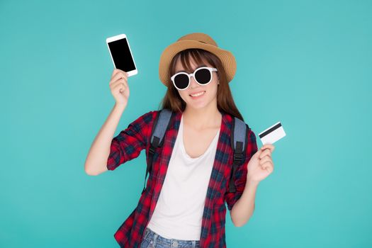 Beautiful portrait young asian woman wear travel summer fashion holding credit card and smart mobile phone in summer, asia girl payment for booking internet online with app in vacation.