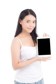 Portrait of asian young woman standing showing blank screen tablet isolated on white background, girl showing technology, business and communication concept.