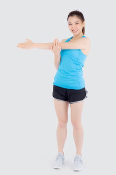 Beautiful portrait young asian woman happy standing stretch muscle arm isolated on white background, girl wear sport clothes smiling exercise yoga for health, healthy and wellness concept.