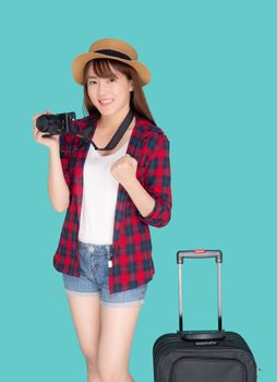 Beautiful young asian woman standing with luggage smiling and travel summer trip for abroad in vacation, asia girl holding camera with suitcase gesture success for journey with cheerful in holiday.