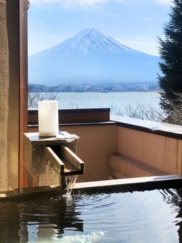 Outdoor hot-spring bath with the beautiful view of Mountain Fuji and Lake Kawaguchiko in Japan