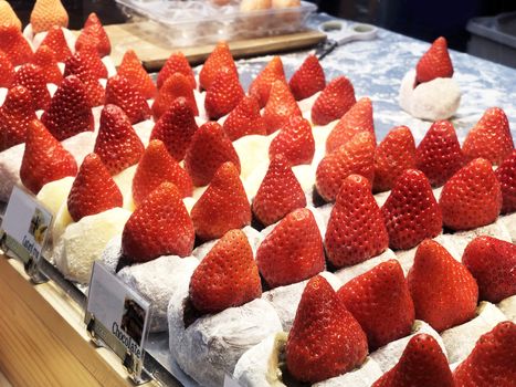 Street food strawberry Daifuku, Strawberry Mochi at Tsukiji Fish Market in Tokyo.