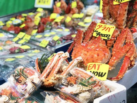 Giant fresh king crab seafood Street food in Tsukiji Fish Market, Japan.

