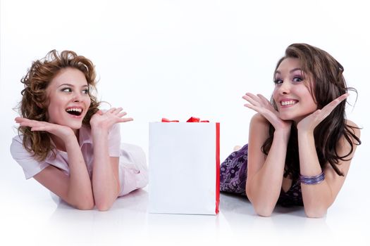 Two young women with shopping bag in different actions and emotions