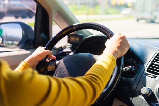 Asian woman while driving the car in the morning during going to work on highway road, Transportation and vehicle concept