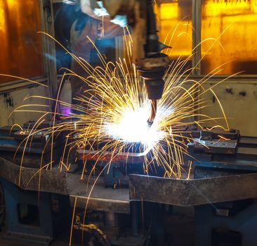 robots welding in a car factory