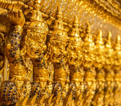 giant statue on the wall in Wat