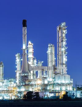 Oil refinery plant at twilight dark blue sk