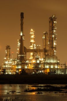 Oil refinery plant at twilight dark blue sky