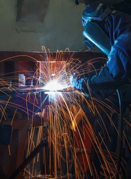 Industrial steel welder in factory