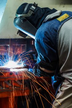 Industrial steel welder in factory