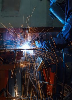 Industrial steel welder in factory