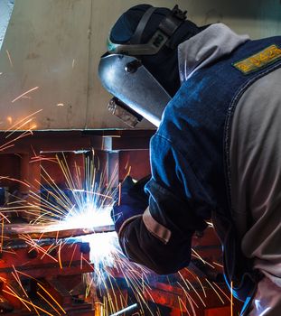 Industrial steel welder in factory