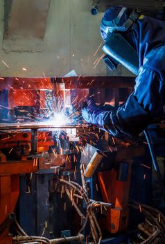 Industrial steel welder in factory