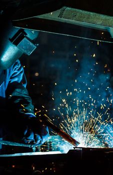 Industrial steel welder in factory