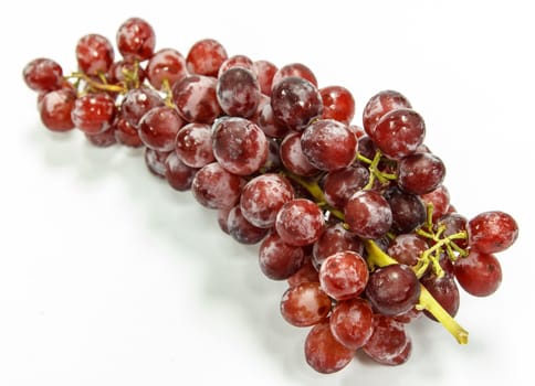 Red grapes on white background