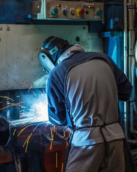 Industrial steel welder in factory