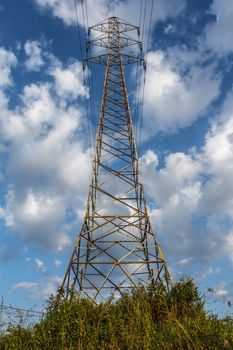 Power transmission lines against blue sky