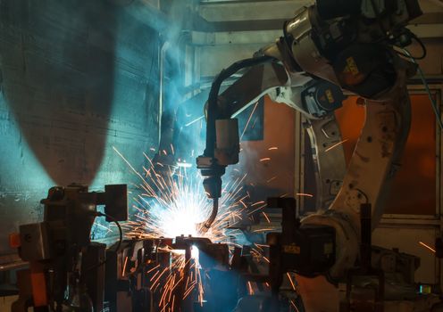 robots welding in a car factory