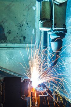 The movement of the welding robot in a car factory