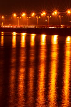 Fire light, beautiful bridge and surface water