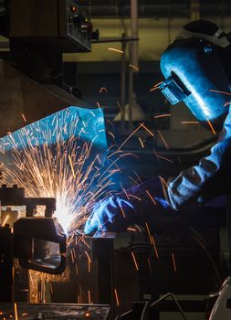 Industrial steel welder in factory