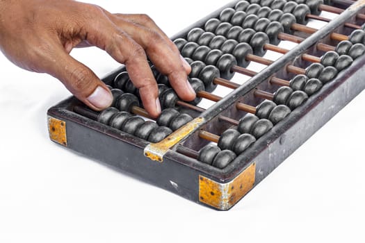 Human hand counting with abacus.