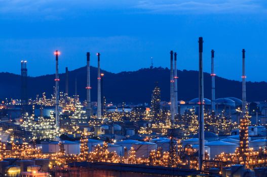 Column tower in petrochemical plant at twilight