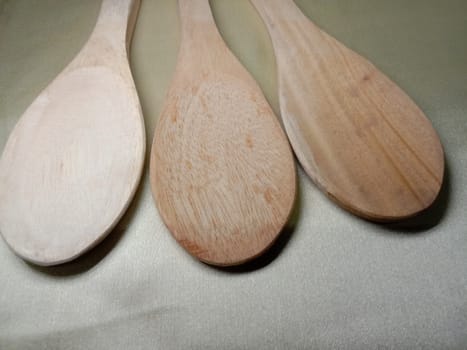wooden spoon closeup on white background