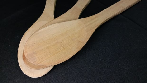 wooden spoon closeup on white background