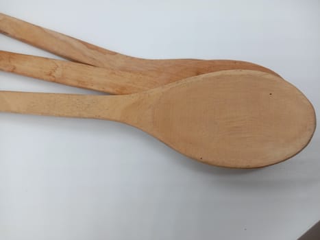 wooden spoon closeup on white background