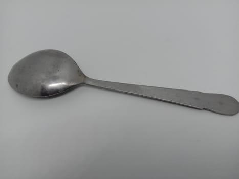 steel spoon closeup on white background