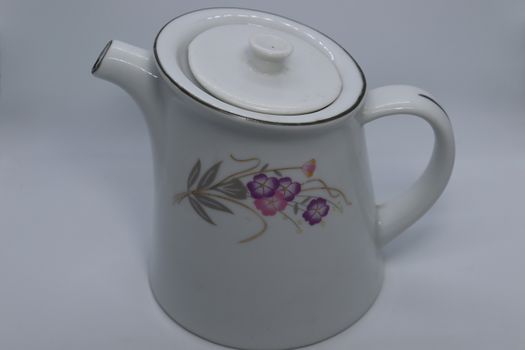 ceramic tea kettle closeup on white background