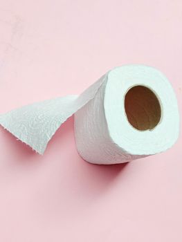 toilet paper tissue closeup on pink background