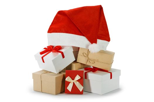Heap of many Christmas gifts and santa hat isolated on white background