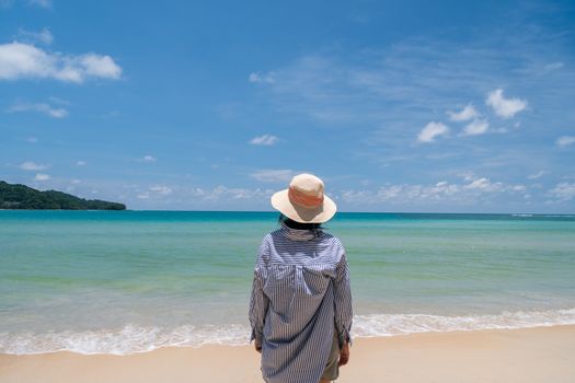 Woman travel around the world with summer beach freedom and relax life concept.