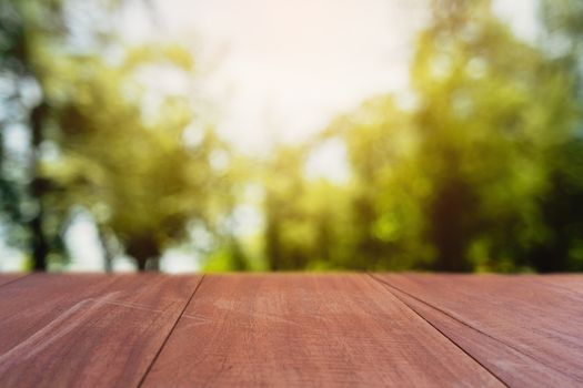 Selective focus of empty old wood on blur nature green leaf with bokeh abstract background.