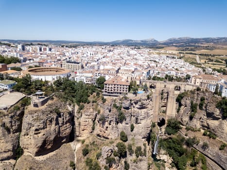 Ronda, Spain - May 31, 2019: Aerial Drone view of the famous bridge Puente Nuevo in the historic city centre.