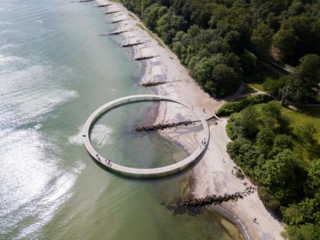 Aarhus, Denmark - June 9, 2019: Aerial drone view of the Infinity Bridge, a work of art by architect Niels Povlsgaard and Johan Gjoedes.