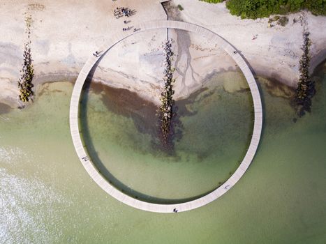 Aarhus, Denmark - June 9, 2019: Aerial drone view of the Infinity Bridge, a work of art by architect Niels Povlsgaard and Johan Gjoedes.