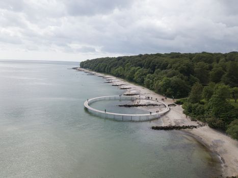 Aarhus, Denmark - June 9, 2019: Aerial drone view of the Infinity Bridge, a work of art by architect Niels Povlsgaard and Johan Gjoedes.